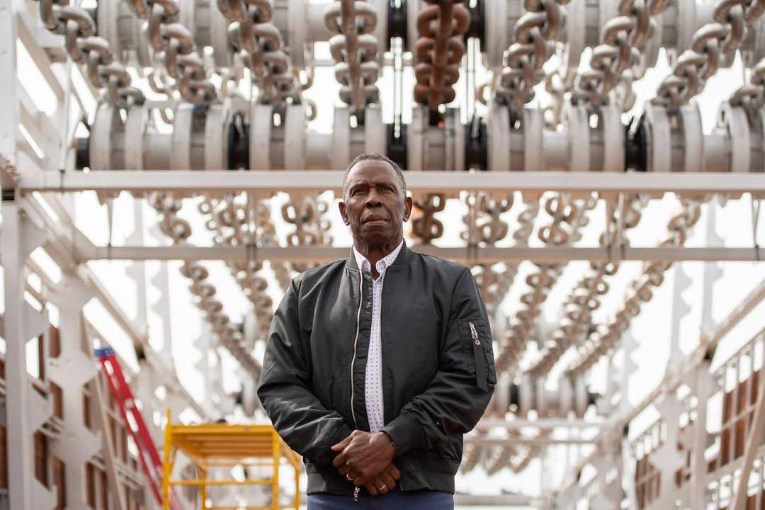 Charles Gaines in front of Moving Chains. Photo by Timothy Schenck